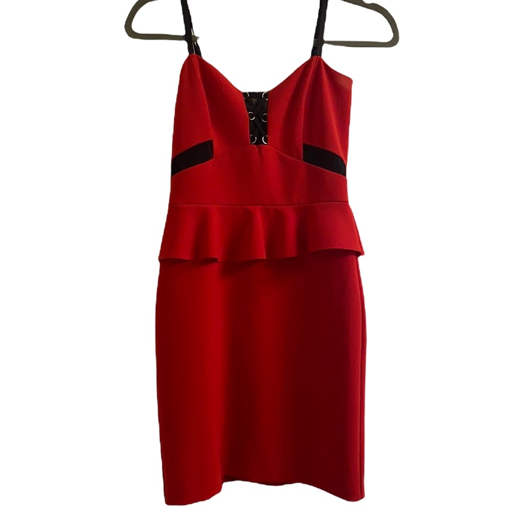 Parker, red peplum dress with black lace cutouts